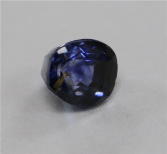 An unmounted shaped oval cushion cut sapphire, weighing approximately 5.70cts.